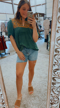 Green and gold embroidered top