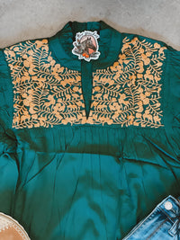 Green and gold embroidered top