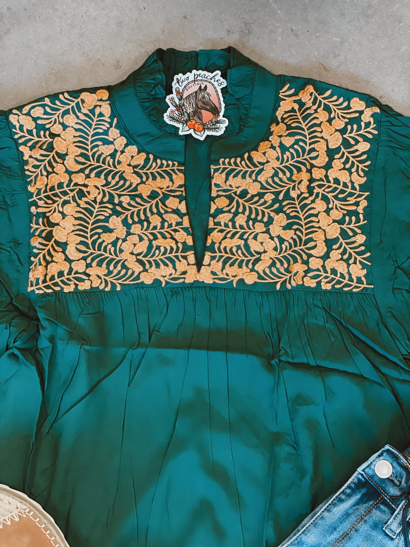 Green and gold embroidered top