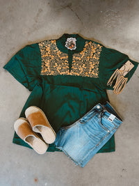 Green and gold embroidered top