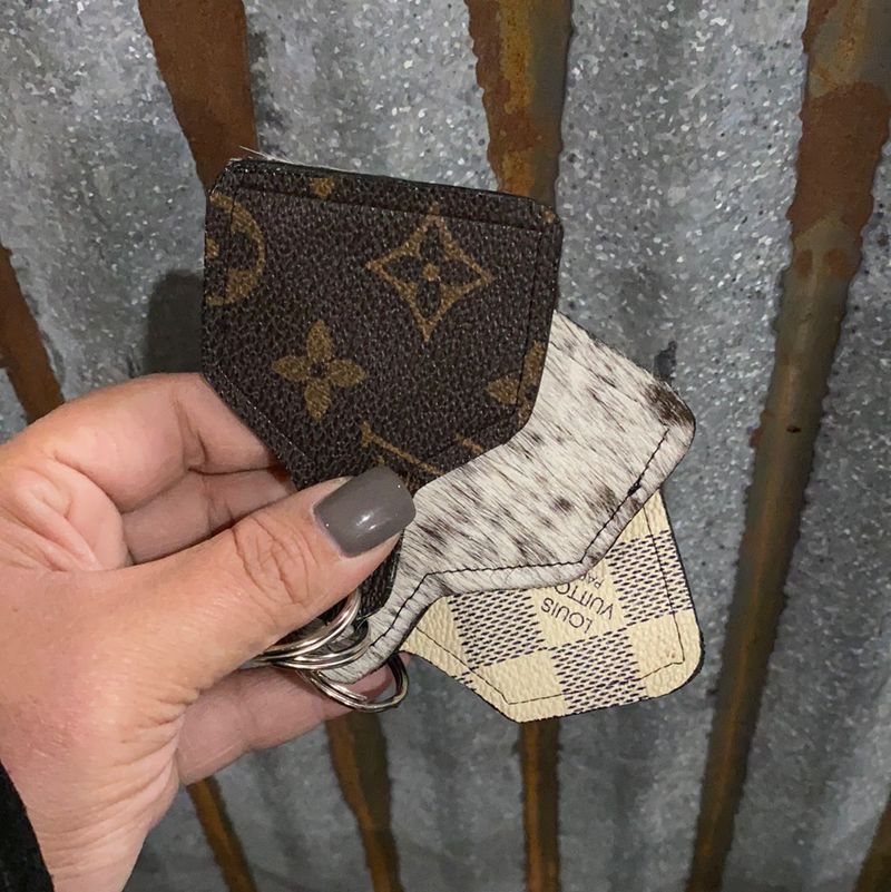ONE OF A KIND LV COWTAG KEYCHAINS
